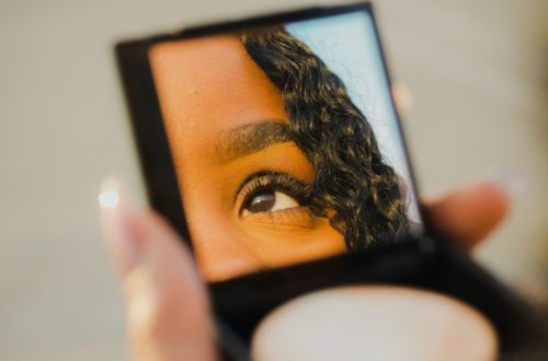 a woman holding a compact compact compact compact compact compact compact compact compact compact compact compact